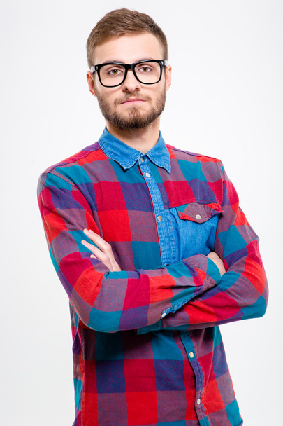 Handsome confident bearded male in glasses with folded hands - Zdjęcie, obraz