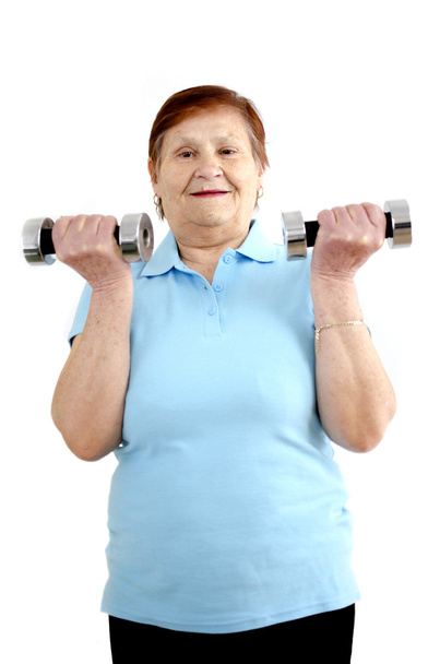 Mature woman doing a workout - 写真・画像