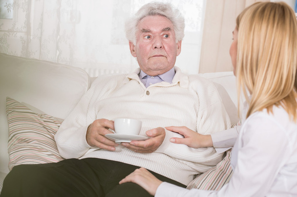 Caregiver and retired man - Фото, зображення