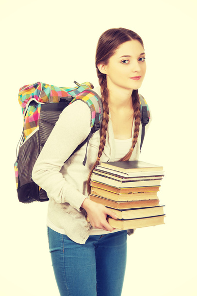 Beautiful teenager with backpack and books. - Φωτογραφία, εικόνα