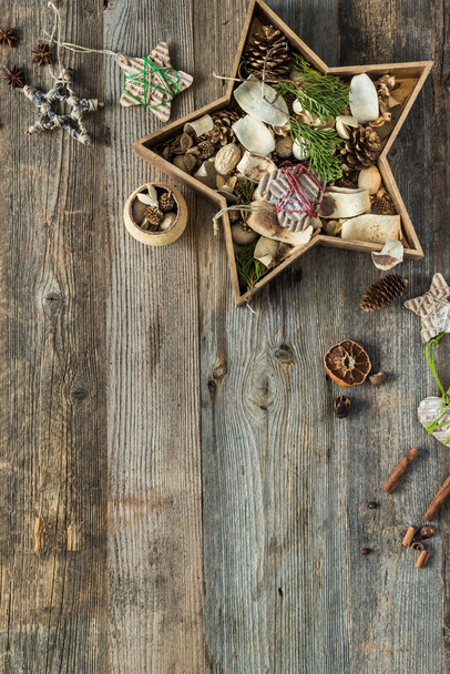 christmas decorations in star shaped box on wooden background with text space - Φωτογραφία, εικόνα