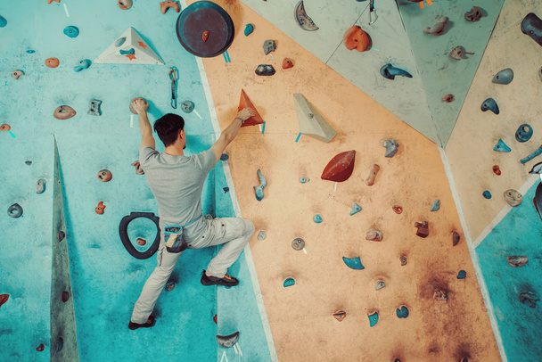 Man climbing in gym - Photo, image