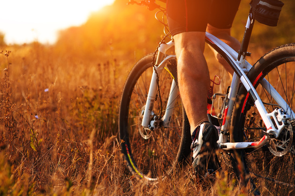 cyclist man legs riding mountain bike outdoor - Photo, Image