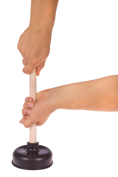 Рука тримає плунжер з дерев'яною ручкою
 - Фото, зображення