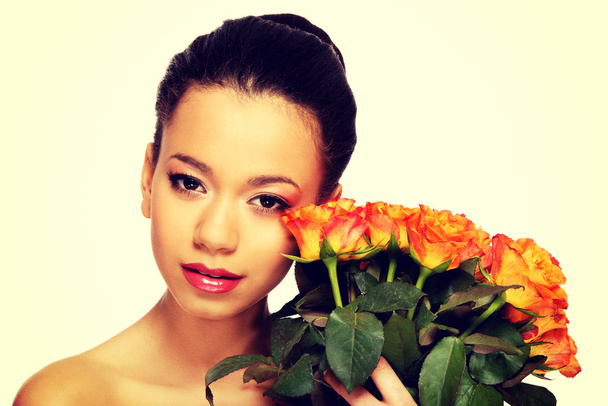 Beauty african woman with roses. - Fotoğraf, Görsel