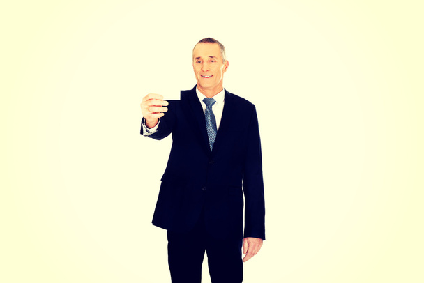 Businessman showing a blank identity name card - Photo, image