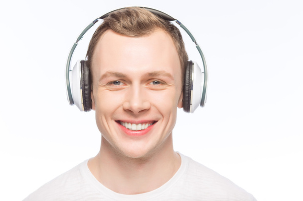 Handsome man wearing headphones. - Фото, зображення