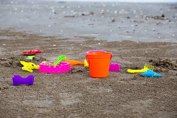 Children's beach toys - buckets spade and shovel on sand - Valokuva, kuva