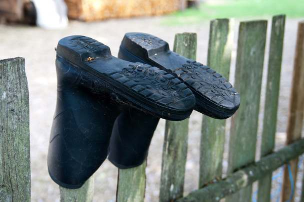 Vecchi stivali di gomma
 - Foto, immagini