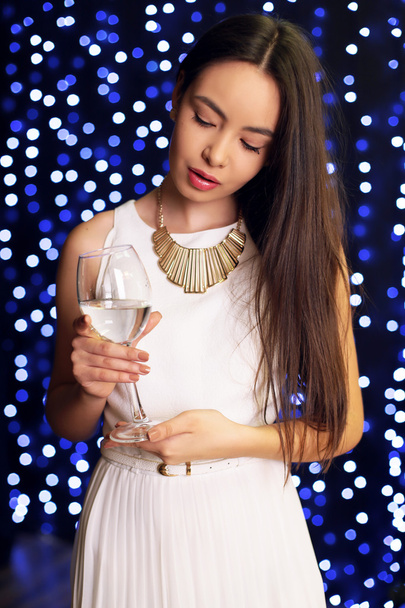 beautiful woman in elegant dress with champagne - 写真・画像