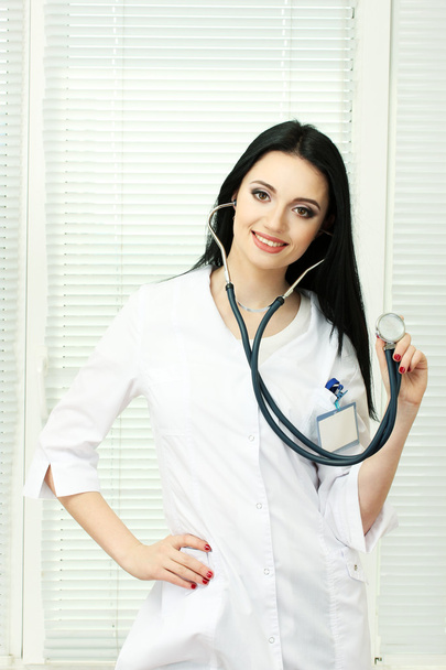 Young beautiful doctor with stethoscope - Foto, immagini