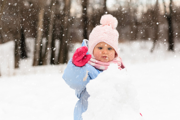 cute little toddler girl play in winter - Foto, imagen