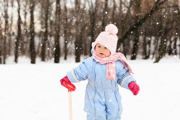 cute little toddler girl play in winter - Фото, изображение