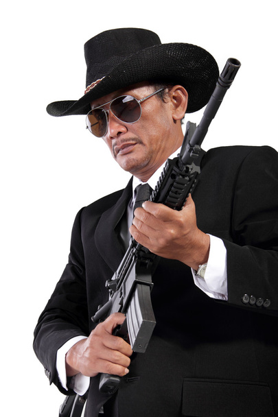 Κύριος με ένα πυροβόλο όπλο, που απομονώνονται σε λευκό  - Φωτογραφία, εικόνα