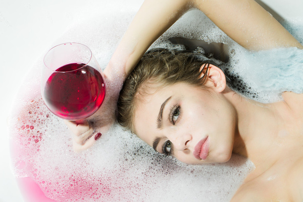 Closeup of woman with glass in bath - Фото, зображення