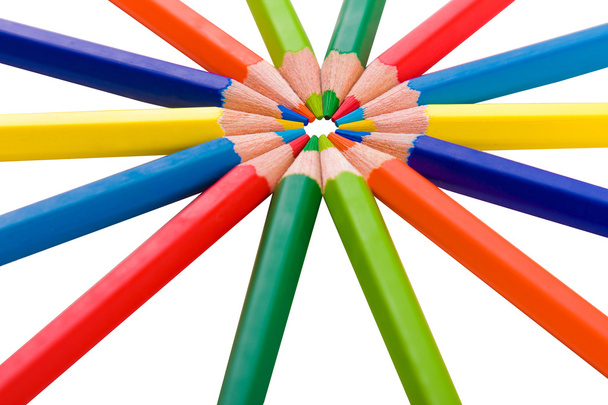 Color pencils in arrange in color wheel colors on white backgrou - 写真・画像