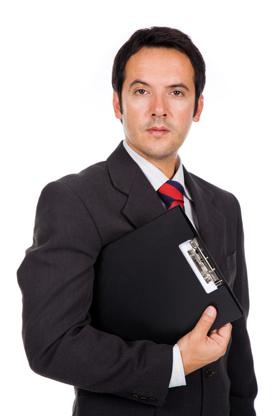 Portrait of a handsome business man standing with binder. Isolat - Фото, изображение