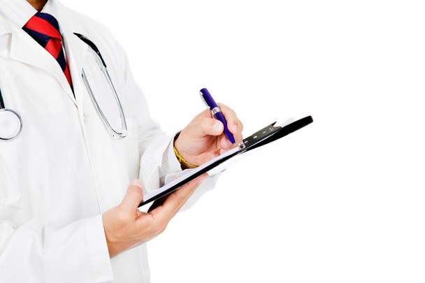 Medical doctor with stethoscope writing. Isolated over white bac - Foto, immagini