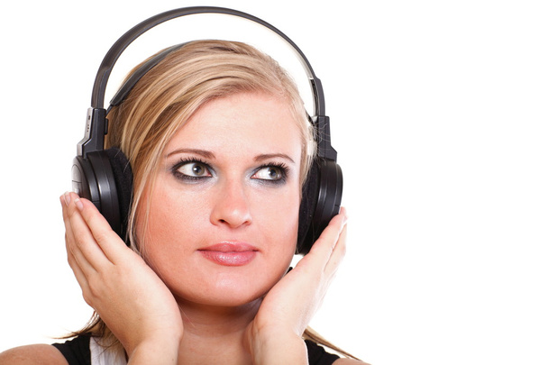 Woman with headphones listening to music isolated white backgrou - 写真・画像