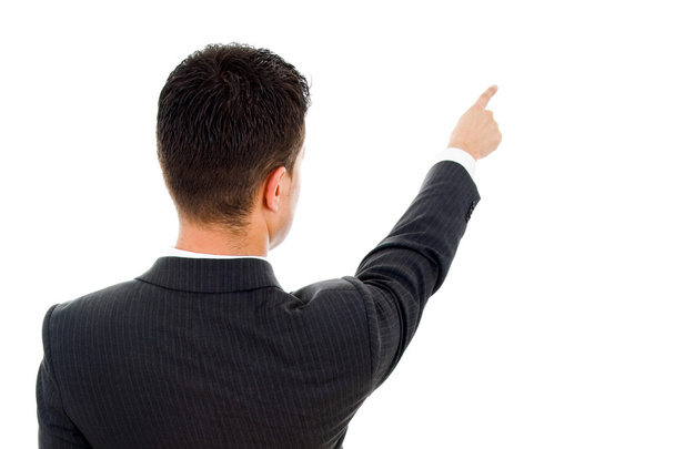 Back view of a young business man pointing at something over whi - Foto, immagini