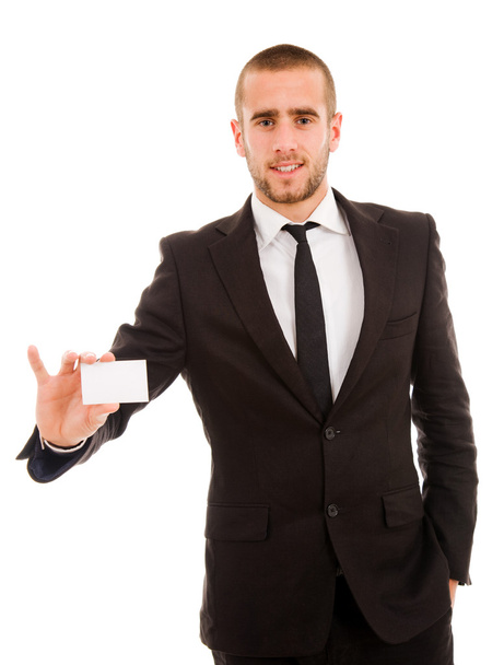 Business man handing a blank business card over white background - 写真・画像