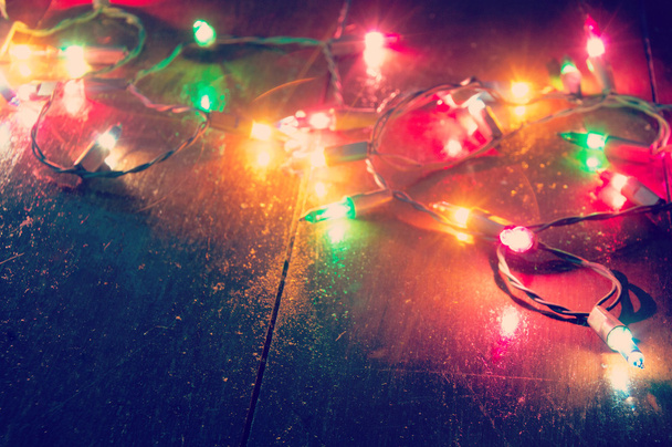 Luce di Natale sullo sfondo di legno
  - Foto, immagini