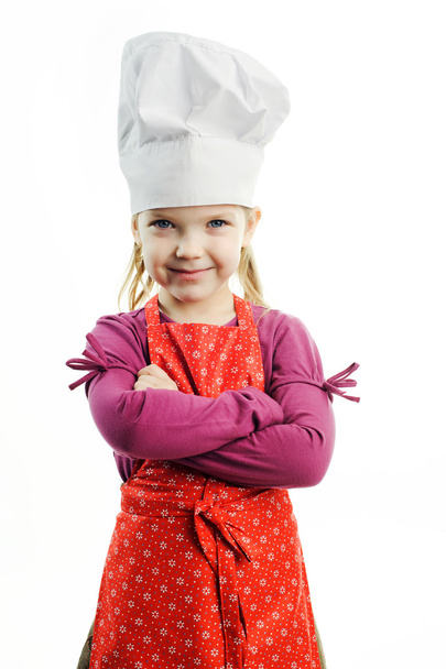 A nice girl in white hat and red apron - Foto, imagen