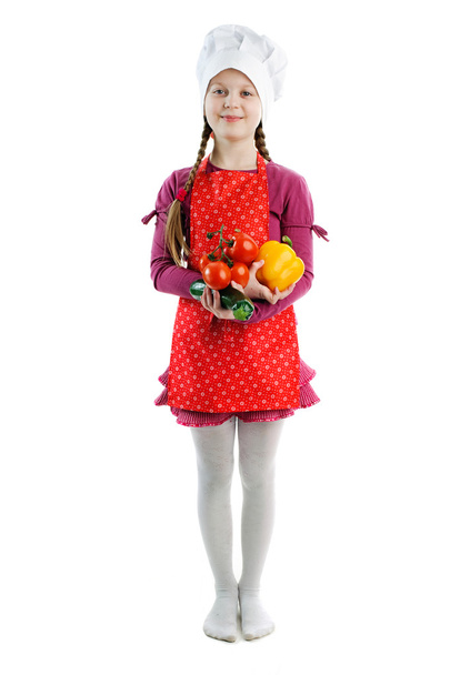 A little girl with fresh vegetables - Foto, afbeelding