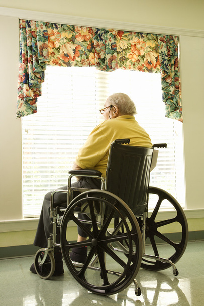 Elderly Man in Wheelchair by Window - Foto, afbeelding