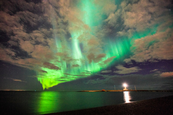 Reflection of the northern lights in the ocean - Photo, Image