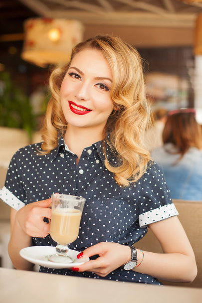 retro beautiful woman in restaurant cafe with coffee - Photo, image