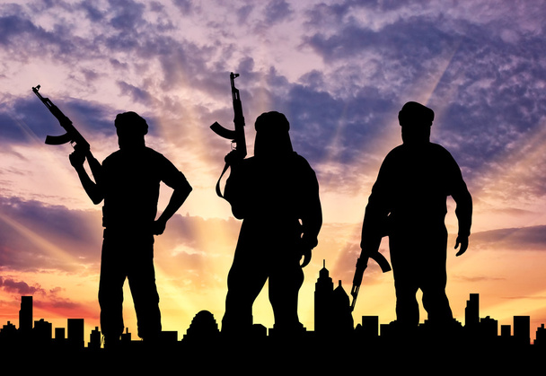 Kolmen terroristin siluetti
 - Valokuva, kuva