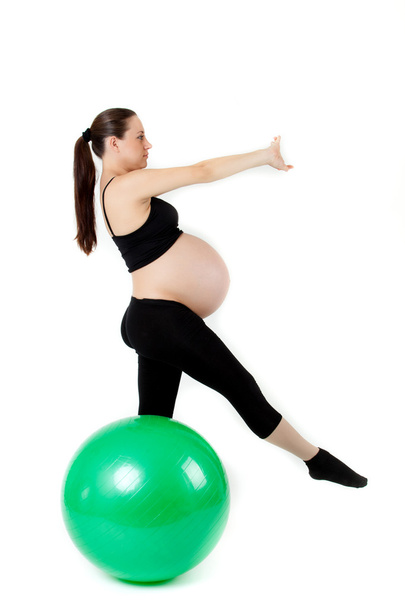 Pregnant woman excercises with gymnastic ball. Beautiful pregnan - Fotó, kép