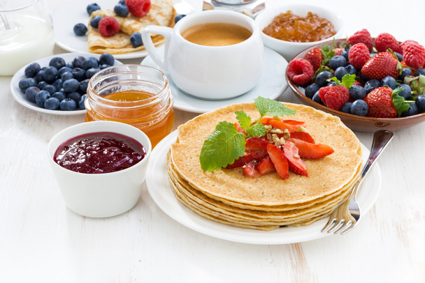 crepes with strawberry, jams and honey - Фото, зображення