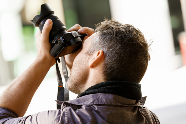 Male photographer taking picture - Valokuva, kuva