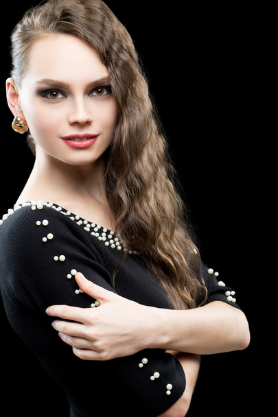 Portrait of beautiful brunette woman in black dress. - Foto, afbeelding