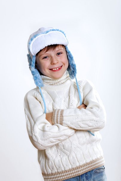 Kid in winter wear against white background - Fotoğraf, Görsel