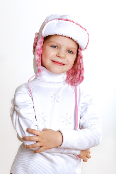 Kid in winter wear against white background - Φωτογραφία, εικόνα