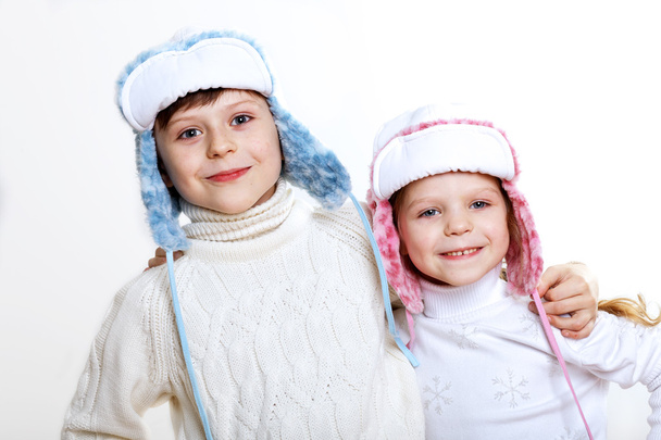 Kid in winter wear against white background - Fotografie, Obrázek