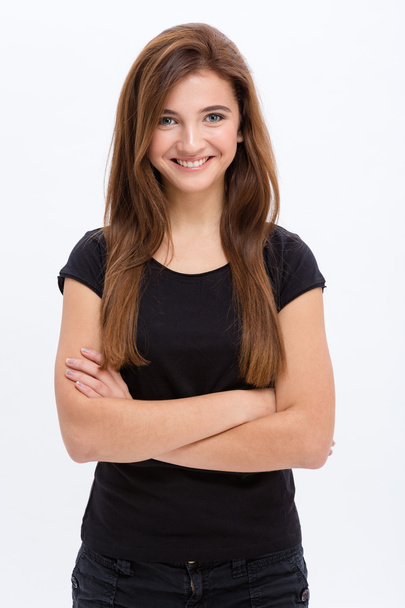 Beautiful happy young woman standing with arms crossed - Photo, Image