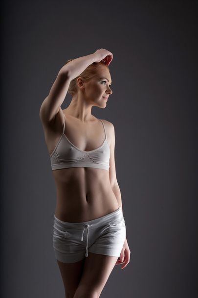 Young sexy ballet girl posing in training cloth - Fotoğraf, Görsel