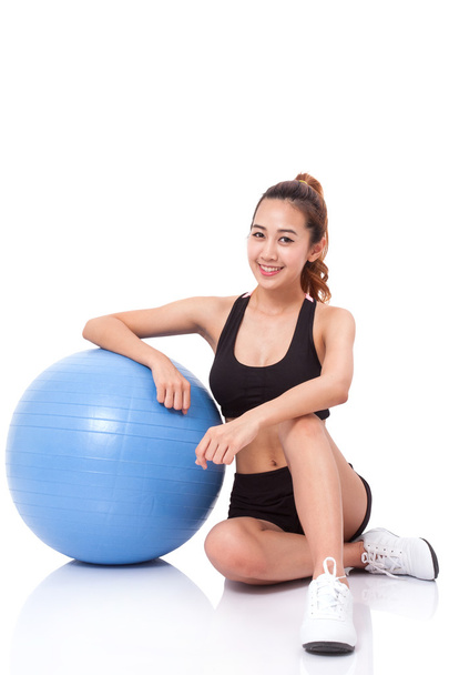 woman training with exercise ball - 写真・画像