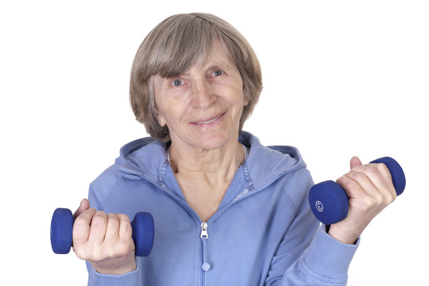 Older mature woman lifting weight - Valokuva, kuva