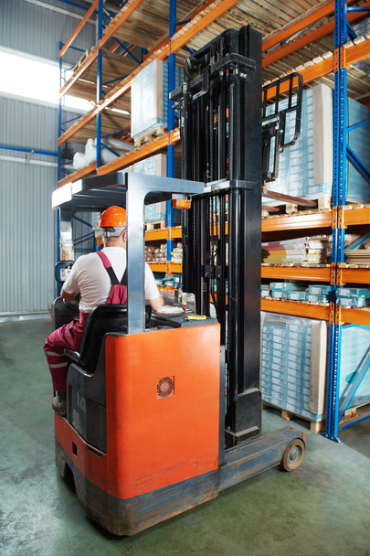 Warehouse forklift loader at work - Foto, Bild