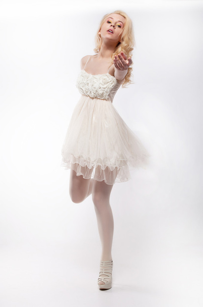 Emotions - running lovely girl blonde on white background - Fotografie, Obrázek