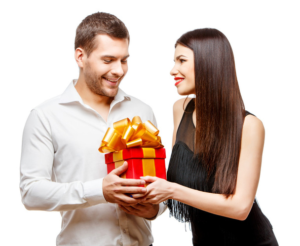 Young beautiful couple with present isolated on white - Fotó, kép