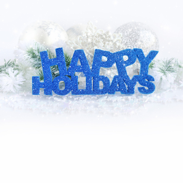 Inscription of happy holidays with christmas decorations - Foto, imagen
