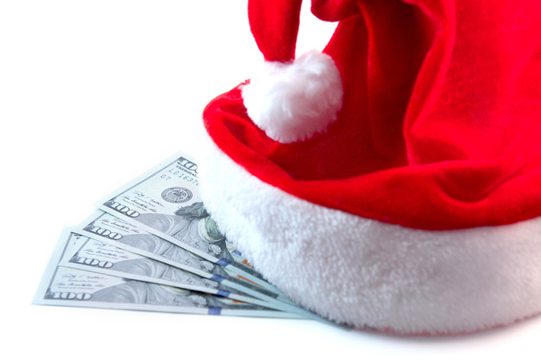Bons de dollars sous le chapeau du Père Noël isolé sur fond blanc
 - Photo, image