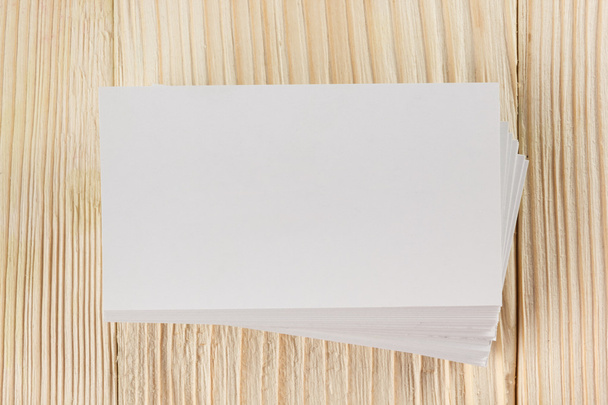 White blank business visit card, gift, ticket, pass, present close up on wooden background. Copy space Blank corporate identity package business card Template for ID - Photo, Image
