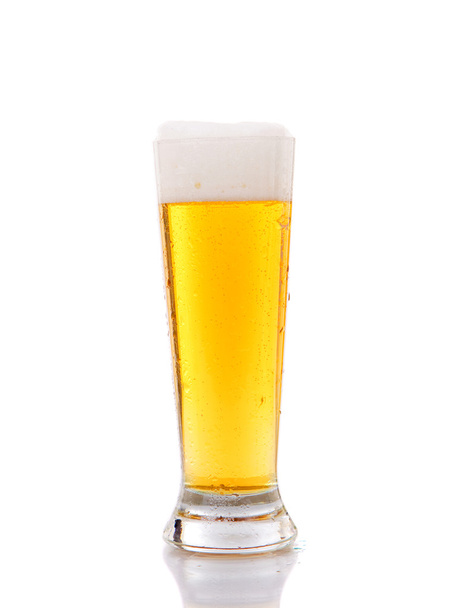 Glass of beer close-up with froth - Фото, изображение